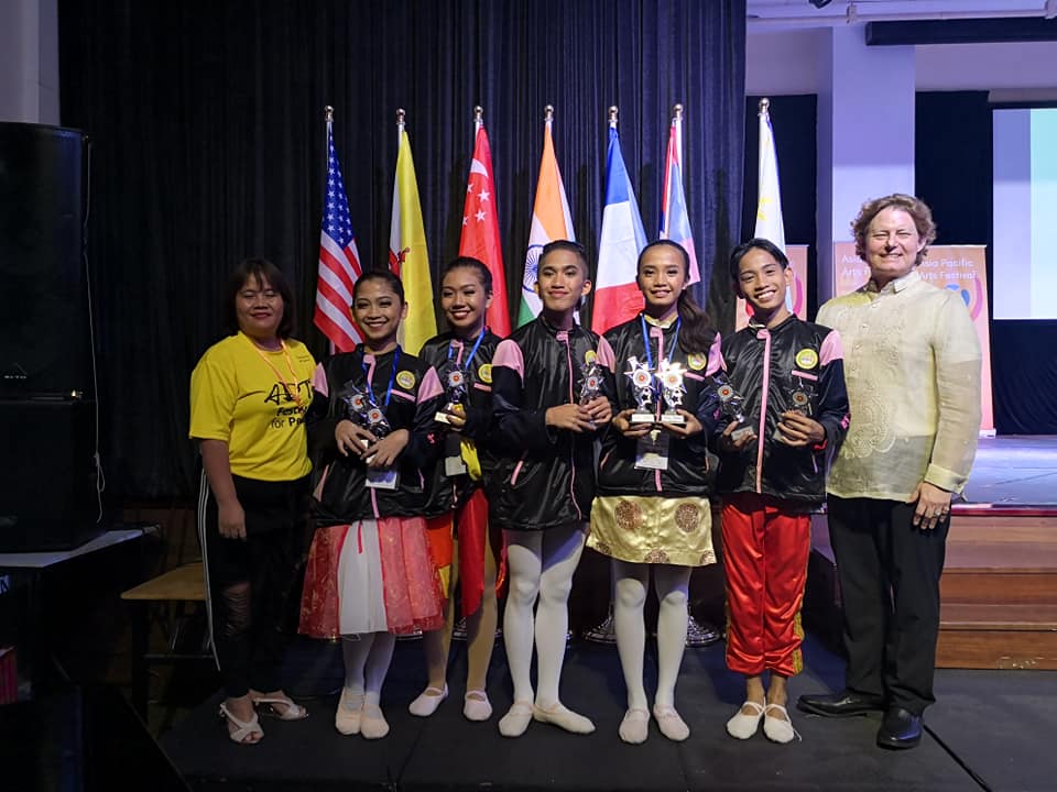 City of Bogo Science and Arts Students posing after winning at the Asia Pacific and Arts Festival - Ballet Competition 2019 with their principal Mrs. Elizabeth Bilaos and with Balletcenter Cebu's Artistic Director, Mr. Gregory Aaron.